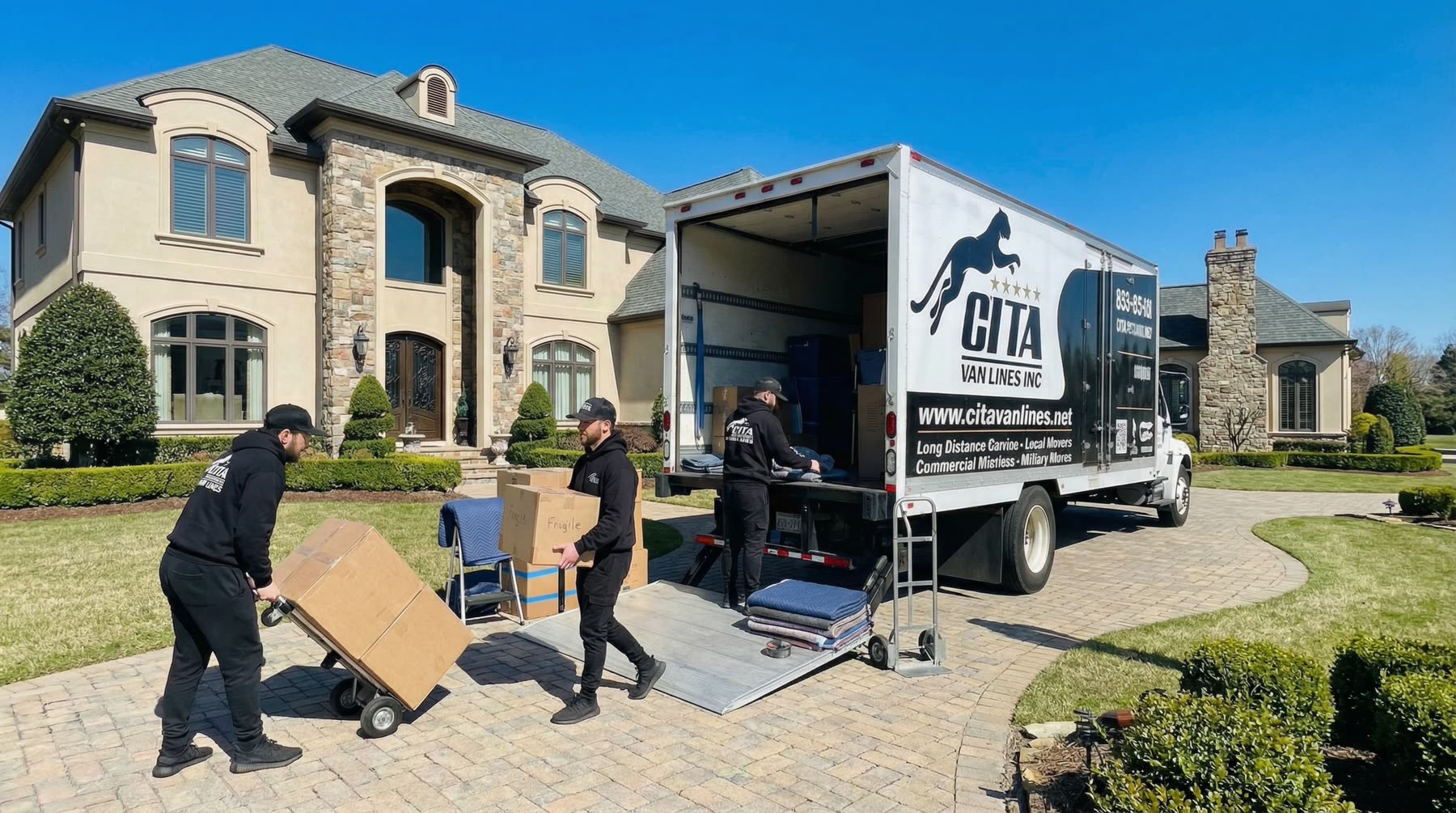 Cita Van Lines movers unloading at a luxury home