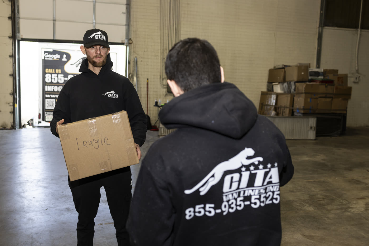 Movers carrying boxes